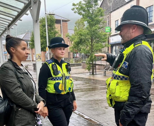 Picture of Police and Crime Commissioner, Emma Wools, talking to police officers